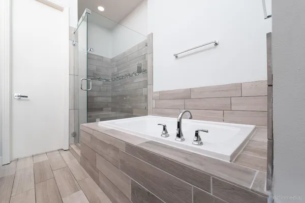 a bathroom with a sink and a shower
