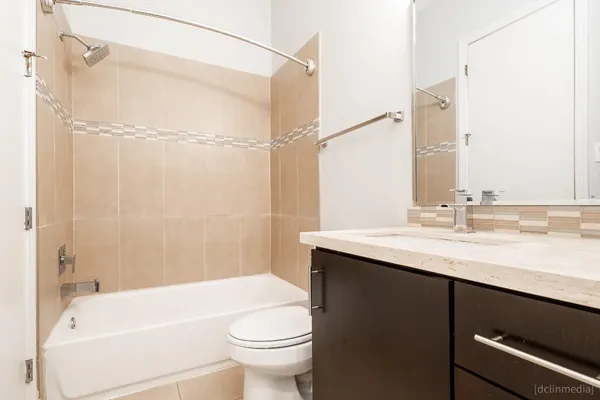 a bathroom with a sink a toilet and a bathtub