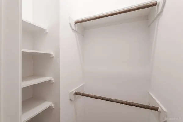 a view of small space with racks on the wall