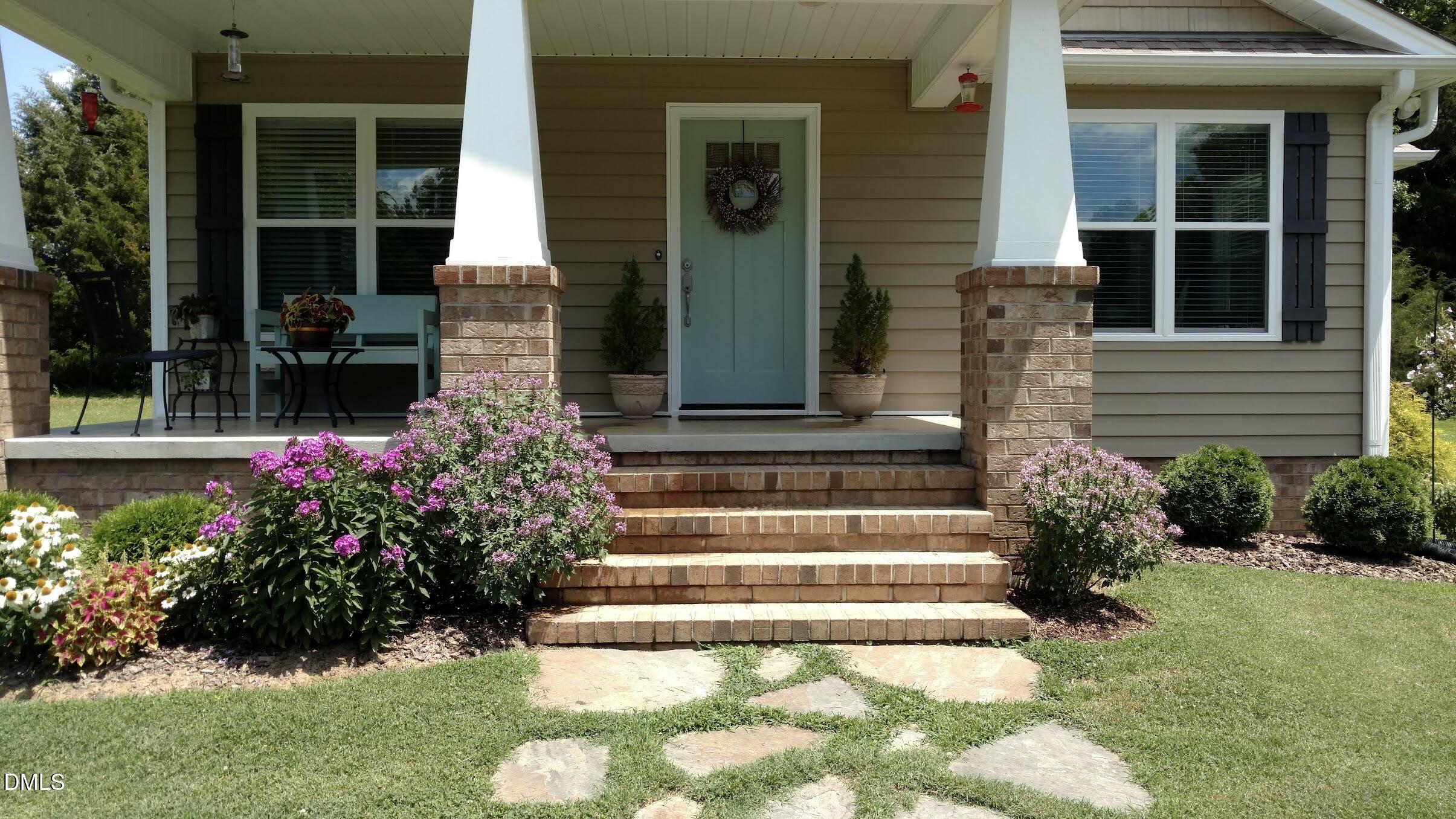 7046 Holts Store Road Burlington, NC 27215 - Photo 2 of 40 Front porch in bloom