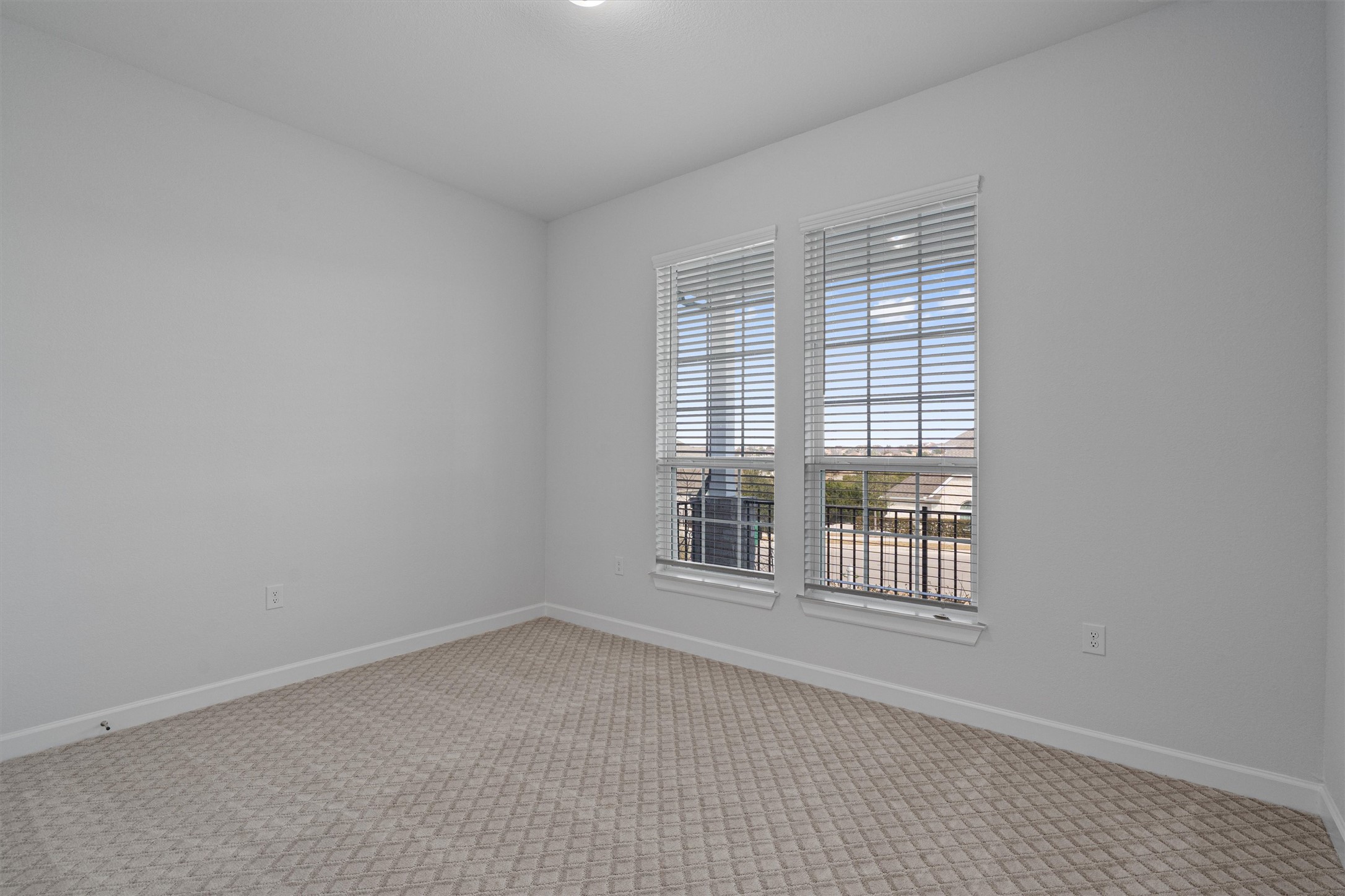 208 Lodestone Lane Austin, TX 78738 - Photo 19 of 38 Spare room with baseboards and light carpet