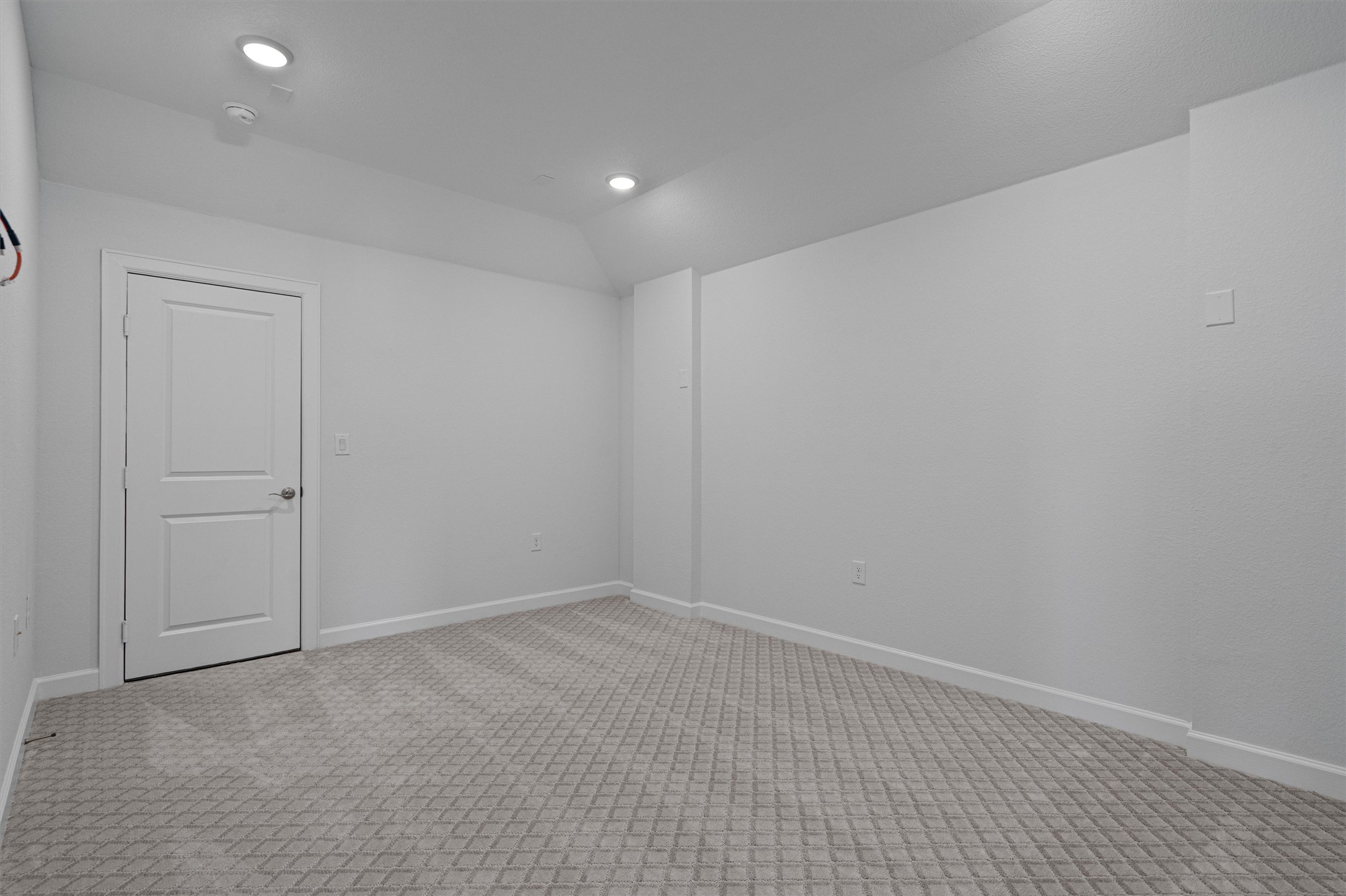 208 Lodestone Lane Austin, TX 78738 - Photo 24 of 38 Unfurnished room with light colored carpet and lofted ceiling