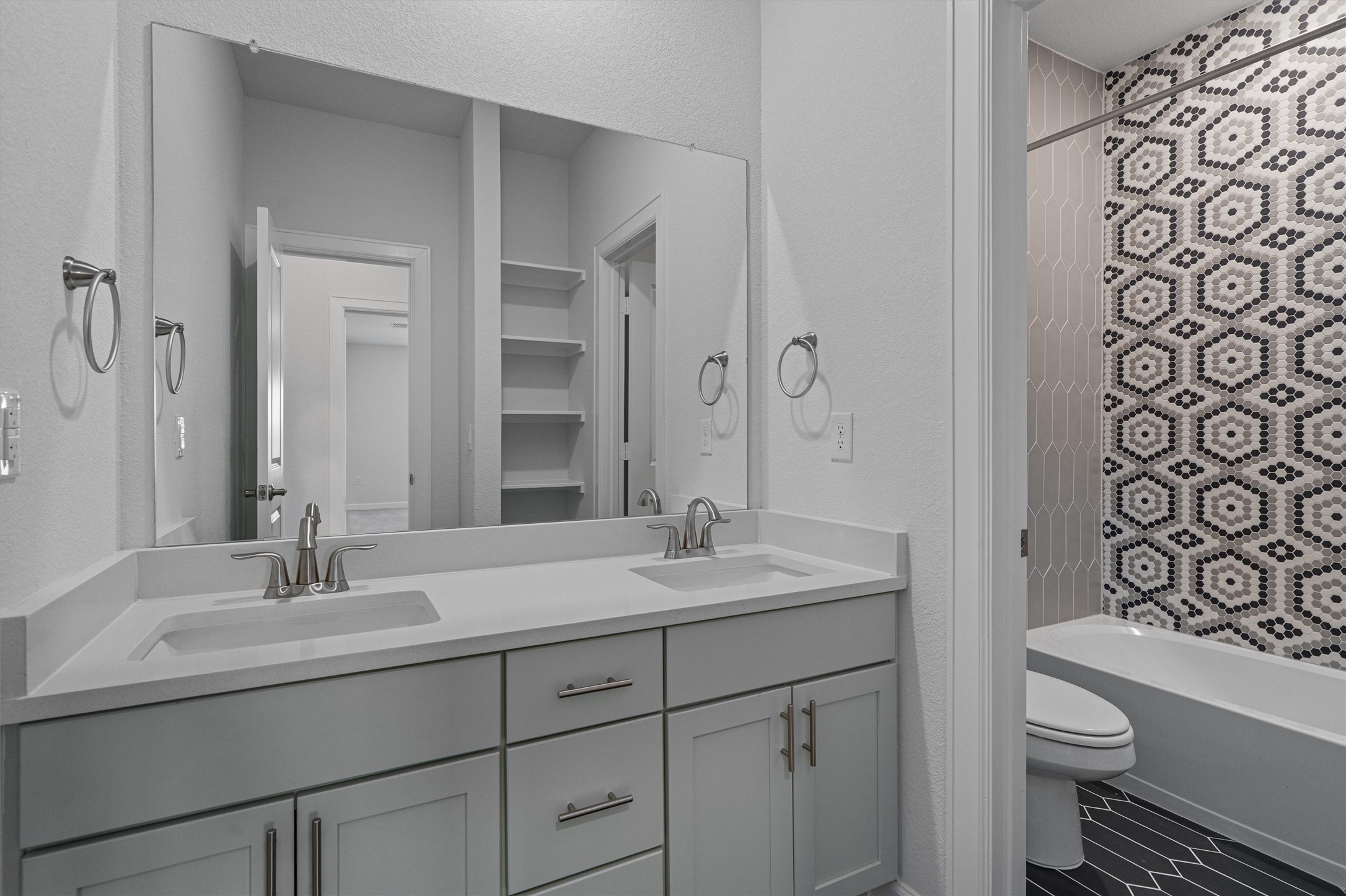 208 Lodestone Lane Austin, TX 78738 - Photo 31 of 38 Full bath featuring double vanity and bathtub / shower combination