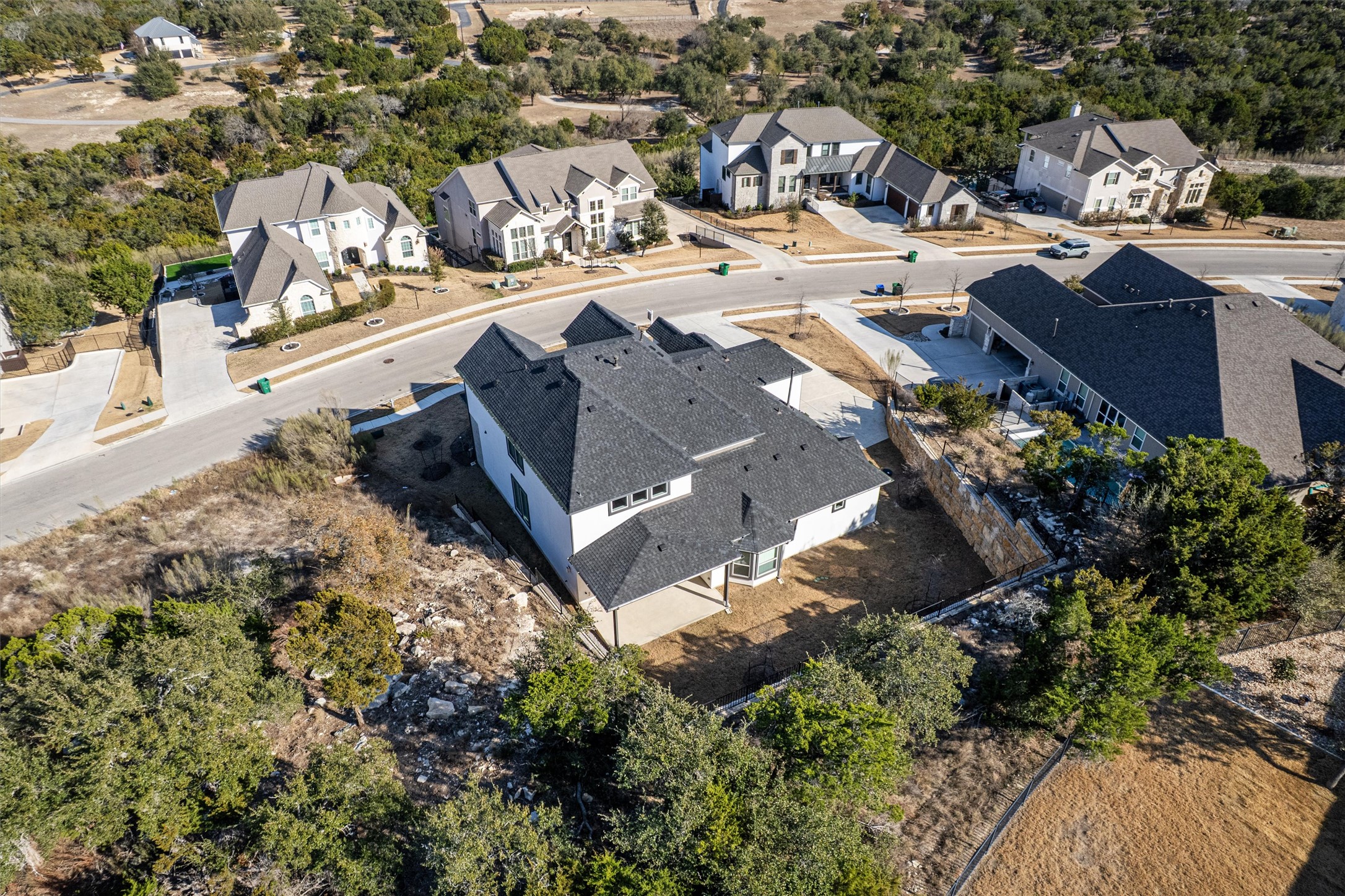 208 Lodestone Lane Austin, TX 78738 - Photo 34 of 38 Aerial view of residential area featuring a tree filled landscape