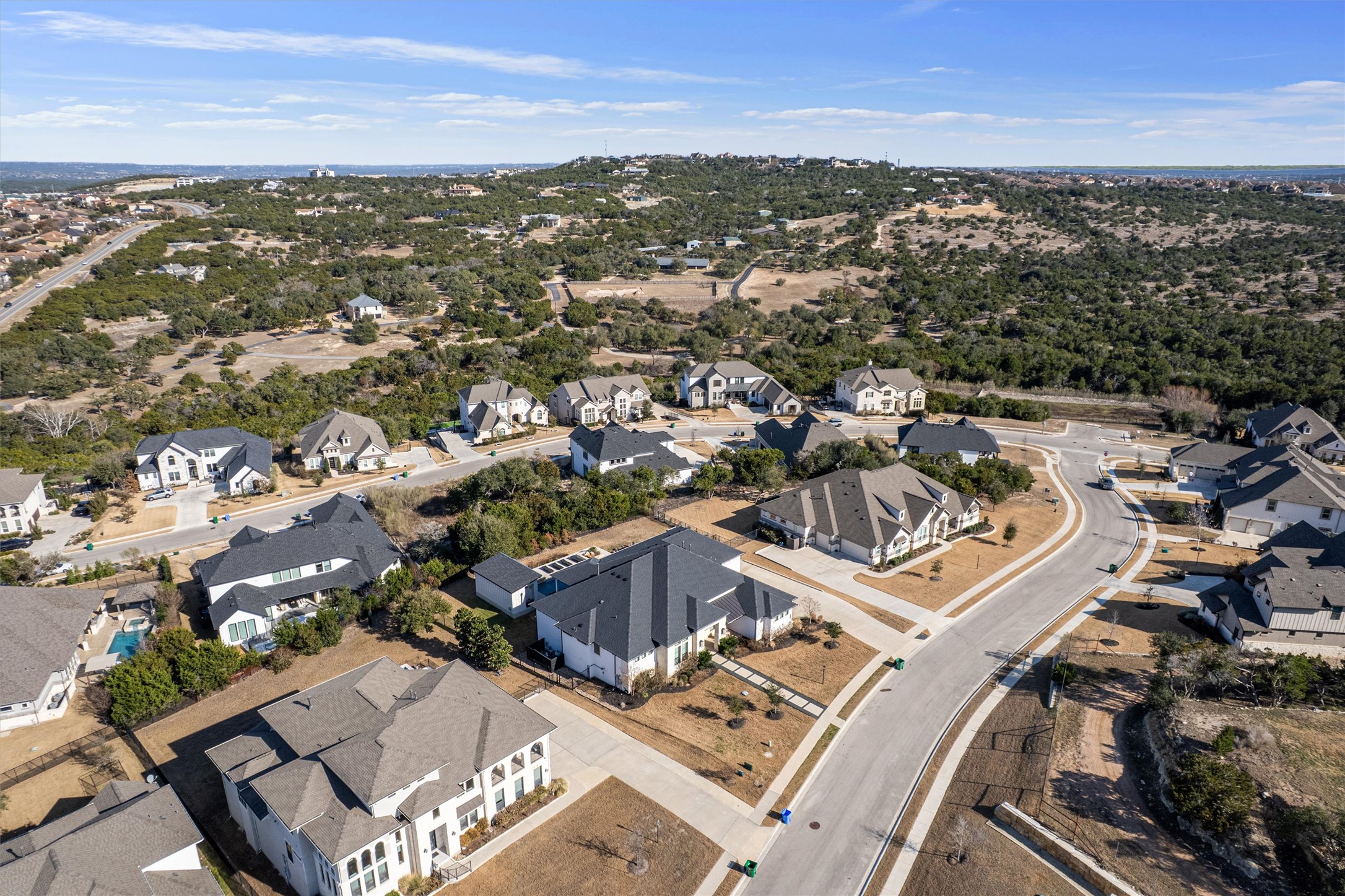 208 Lodestone Lane Austin, TX 78738 - Photo 35 of 38 Aerial view of property and surrounding area with nearby suburban area