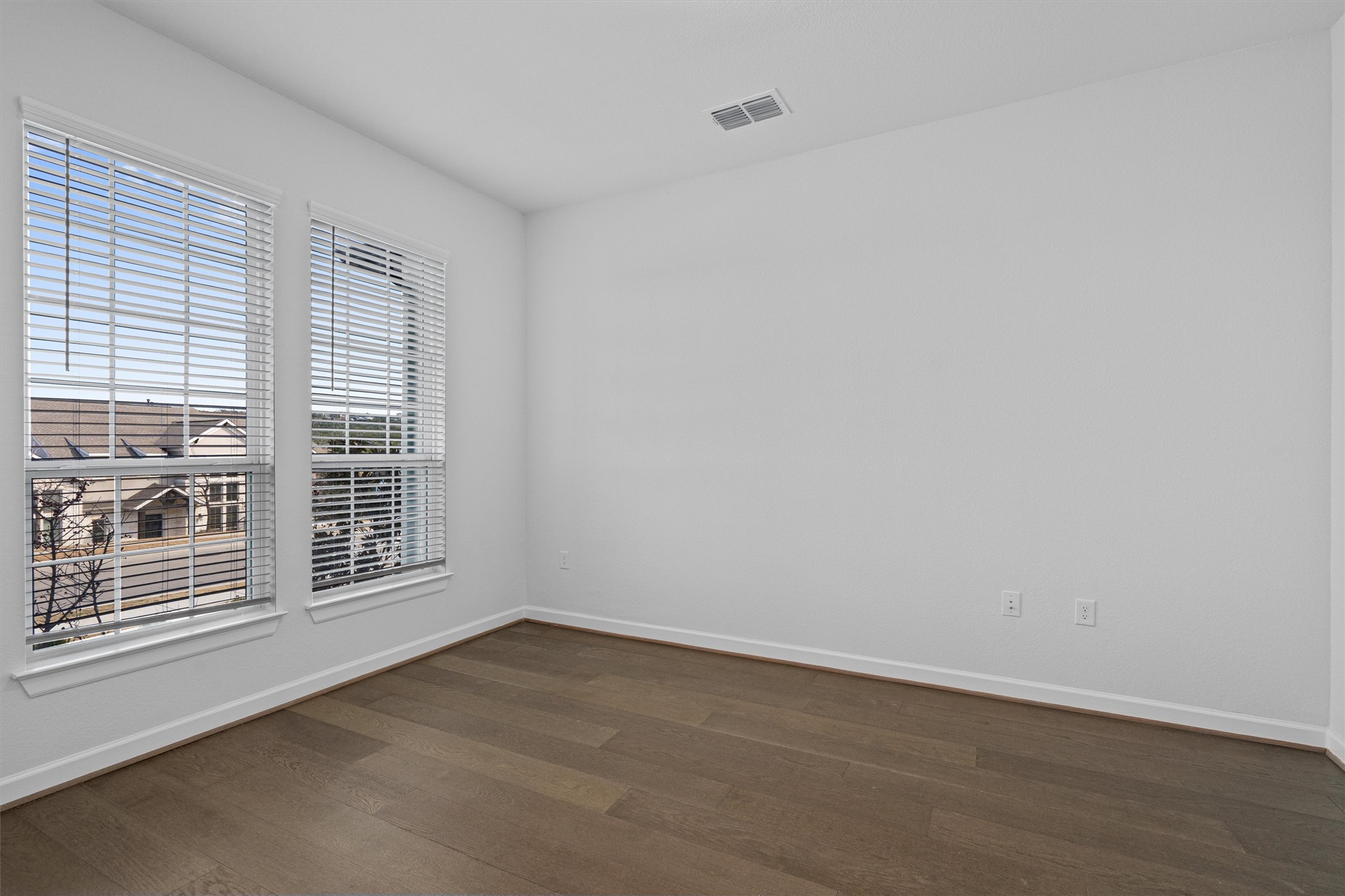 208 Lodestone Lane Austin, TX 78738 - Photo 5 of 38 Unfurnished room with baseboards and dark wood finished floors