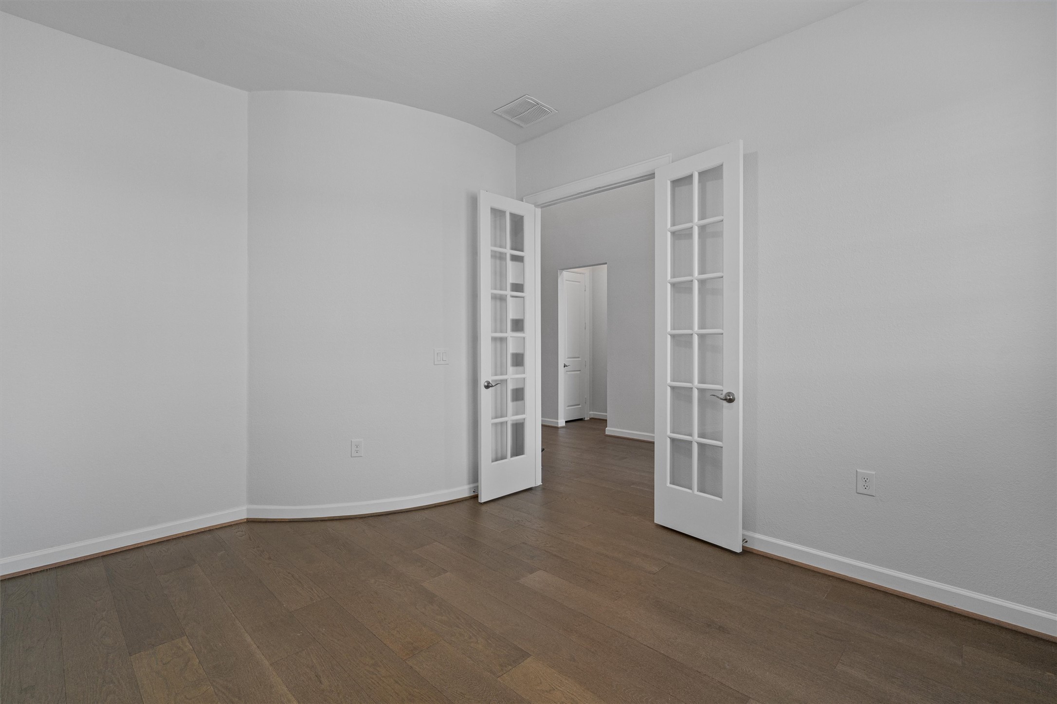 208 Lodestone Lane Austin, TX 78738 - Photo 6 of 38 Empty room with dark wood-style flooring and french doors