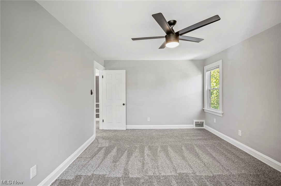 1022 Englewood Road Cleveland, OH 44121 - Photo 26 of 33 Carpeted spare room featuring ceiling fan