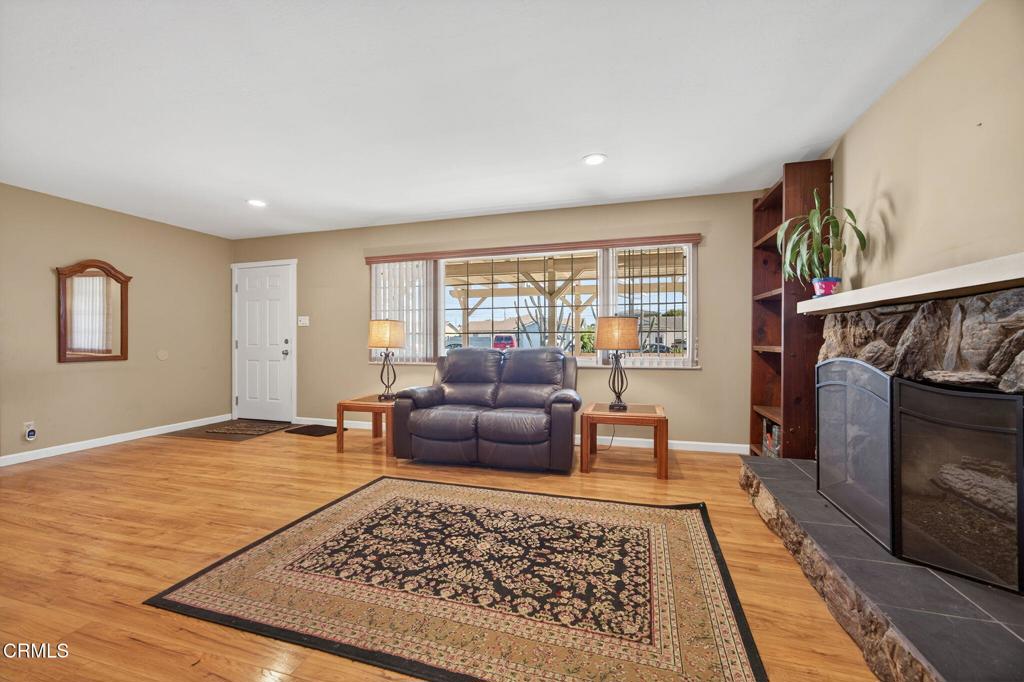 4029 South B Street Oxnard, CA 93033 - Photo 11 of 34 a living room with furniture and a rug