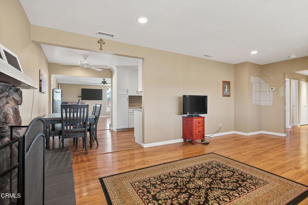 4029 South B Street Oxnard, CA 93033 - Photo 13 of 34 a living room with wooden floor and furniture