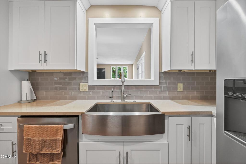 4029 South B Street Oxnard, CA 93033 - Photo 16 of 34 a kitchen with granite countertop a sink and cabinets
