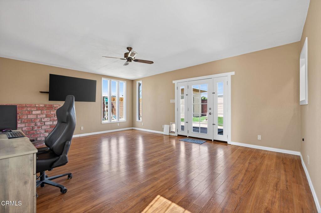 4029 South B Street Oxnard, CA 93033 - Photo 18 of 34 a view of an empty room with a window and wooden floor