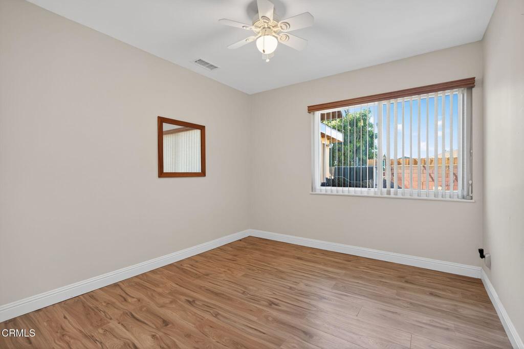 4029 South B Street Oxnard, CA 93033 - Photo 30 of 34 a view of empty room with wooden floor and fan