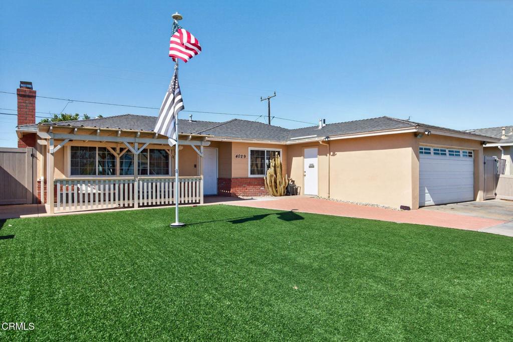 4029 South B Street Oxnard, CA 93033 - Photo 4 of 34 a front view of a house with a yard