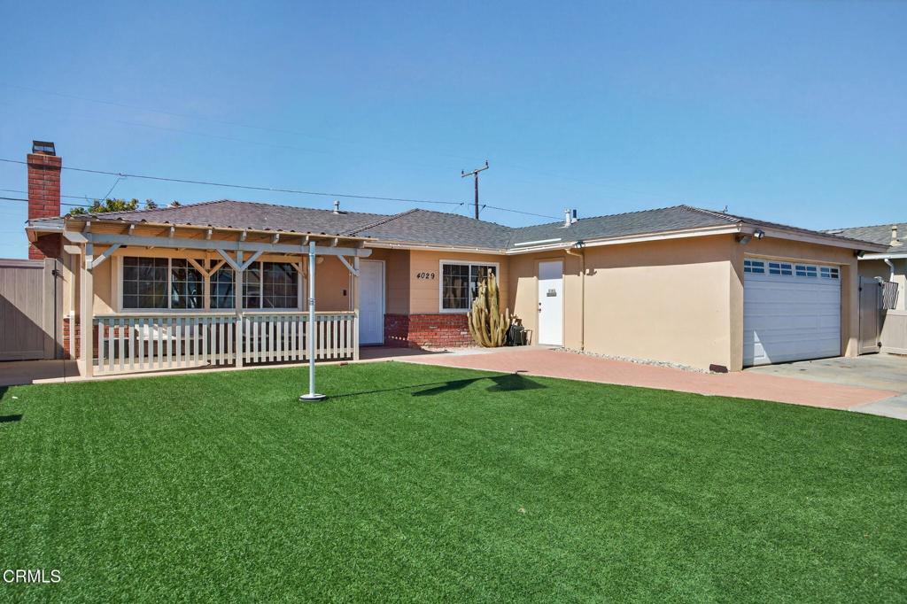 4029 South B Street Oxnard, CA 93033 - Photo 5 of 34 a view of a house with a yard and deck