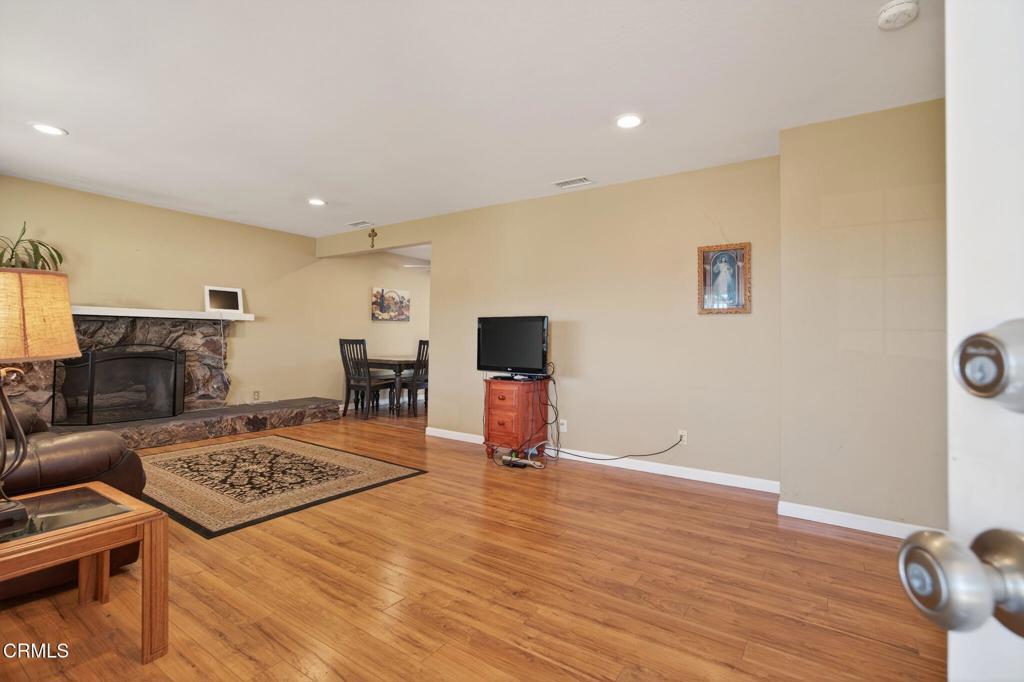 4029 South B Street Oxnard, CA 93033 - Photo 8 of 34 a living room with furniture and a fireplace