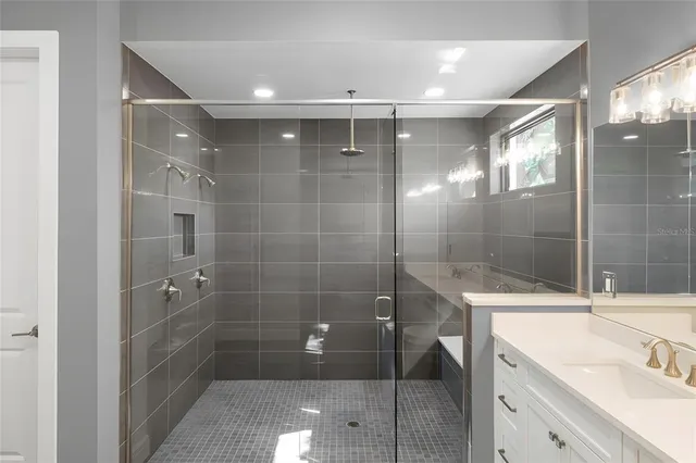 a bathroom with a shower and a sink