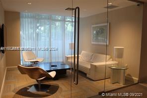 951 Brickell Avenue, Unit 3403 Miami, FL 33131 - Photo 13 of 26 a room with furniture and a potted plant