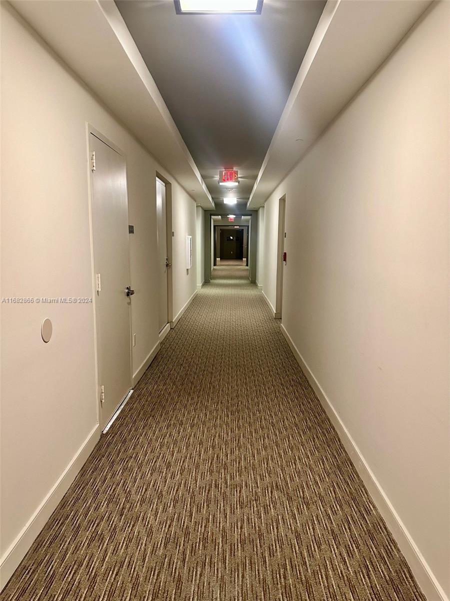 951 Brickell Avenue, Unit 3403 Miami, FL 33131 - Photo 14 of 26 a view of hallway with stairs
