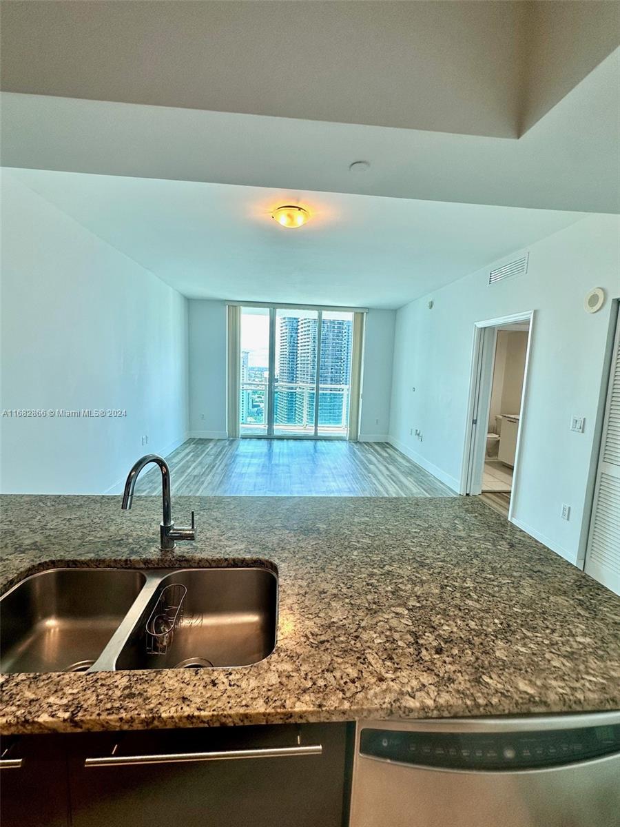 951 Brickell Avenue, Unit 3403 Miami, FL 33131 - Photo 22 of 26 a kitchen with sink and window
