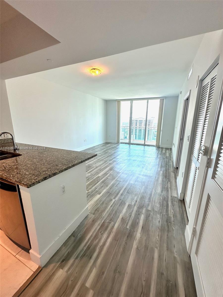 951 Brickell Avenue, Unit 3403 Miami, FL 33131 - Photo 23 of 26 a view of wooden floor and staircase