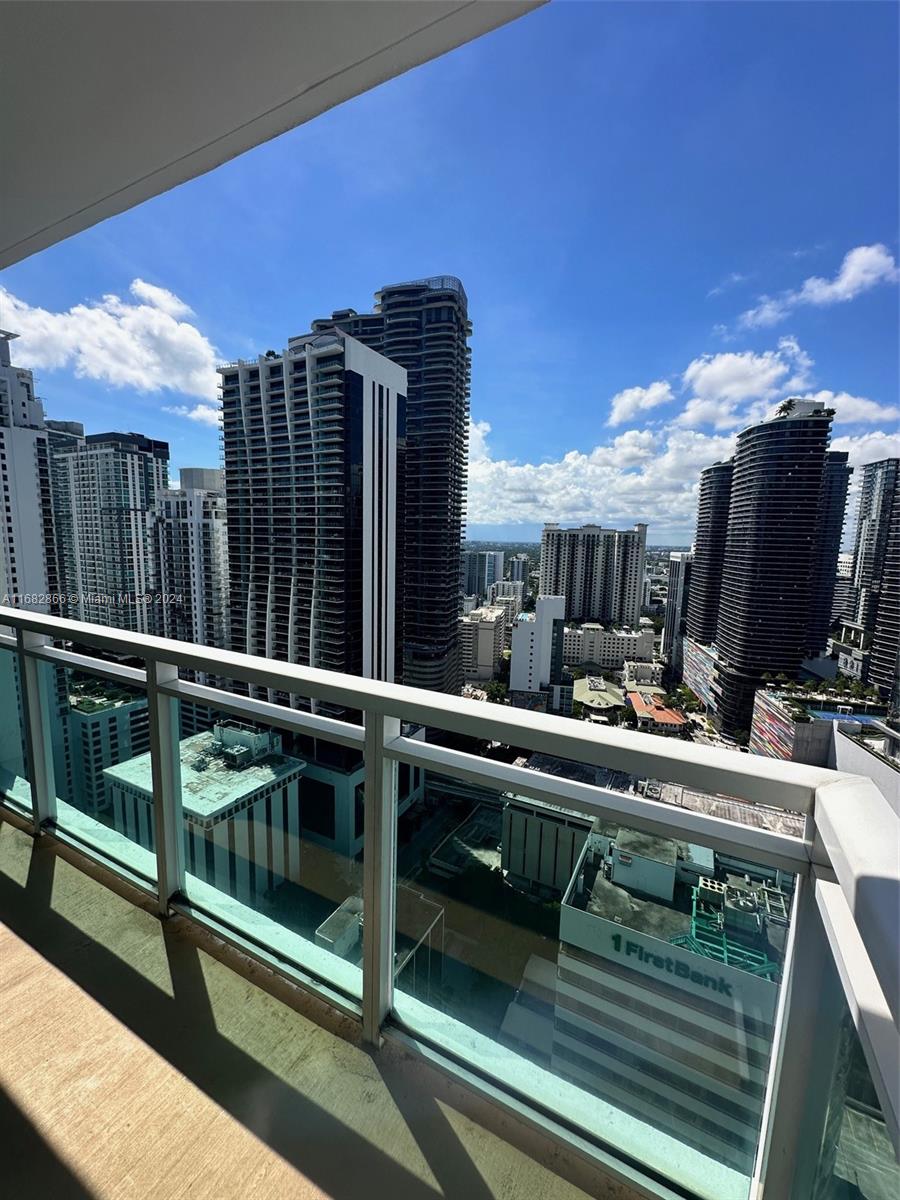 951 Brickell Avenue, Unit 3403 Miami, FL 33131 - Photo 25 of 26 a view of balcony with furniture