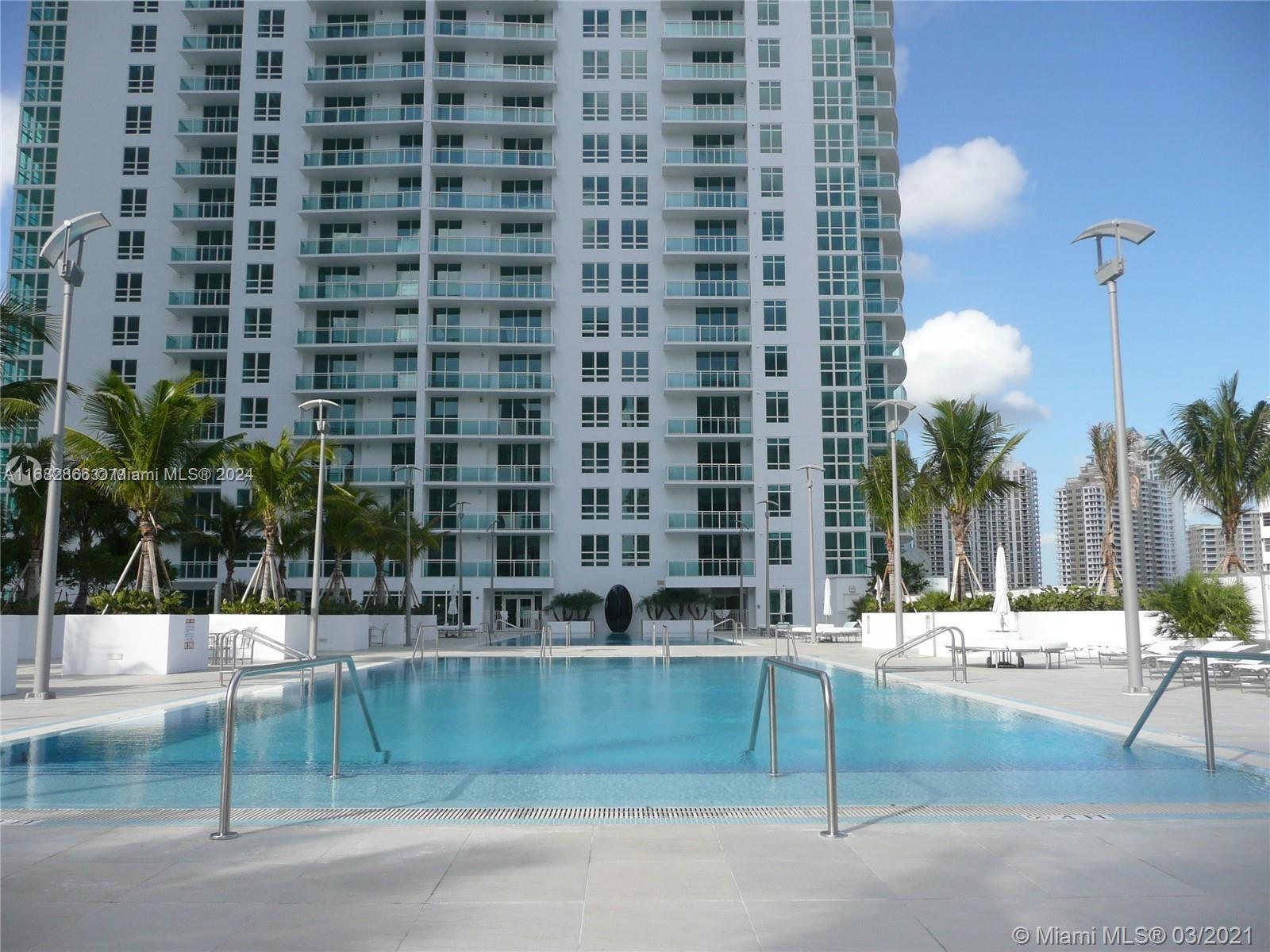 951 Brickell Avenue, Unit 3403 Miami, FL 33131 - Photo 3 of 26 a view of building with yard