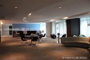 951 Brickell Avenue, Unit 3403 Miami, FL 33131 - Photo 4 of 26 a living room with furniture and a large window