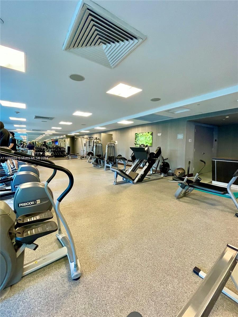 951 Brickell Avenue, Unit 3403 Miami, FL 33131 - Photo 9 of 26 a view of a room with gym equipment