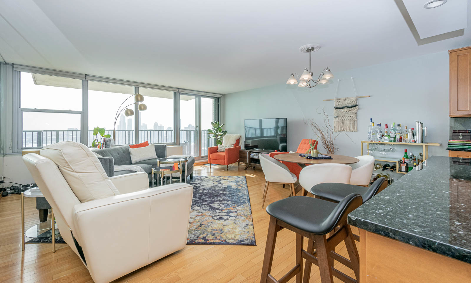 400 East Randolph Street, Unit 3405 Chicago, IL 60601 - Photo 2 of 17 a living room with furniture and a large window