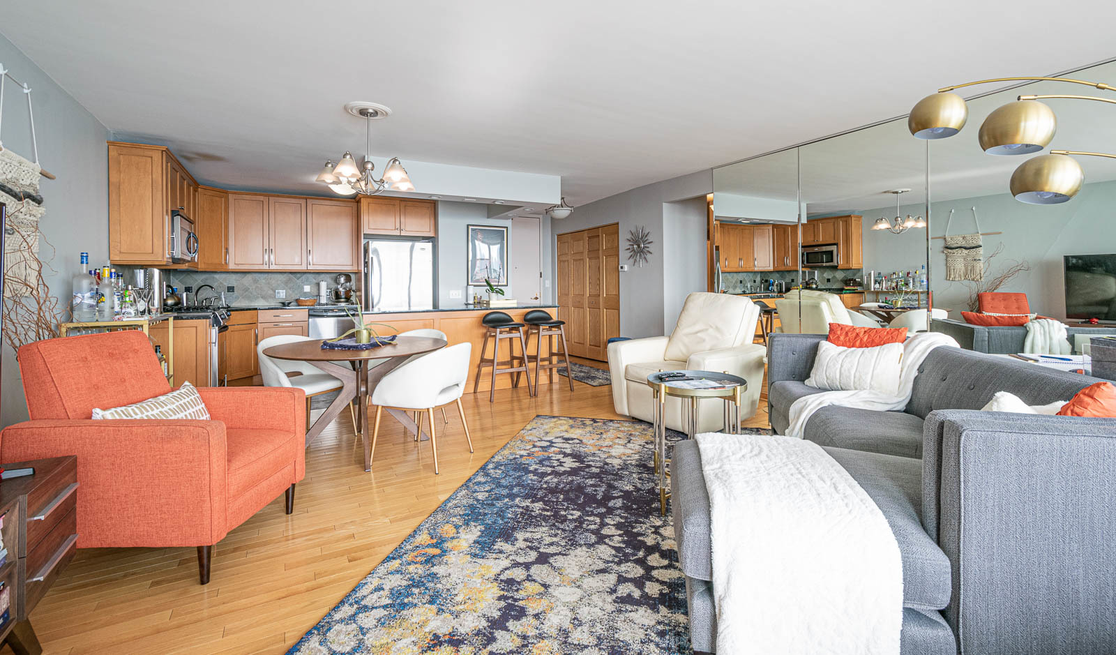 400 East Randolph Street, Unit 3405 Chicago, IL 60601 - Photo 5 of 17 a living room with furniture a rug and a large window