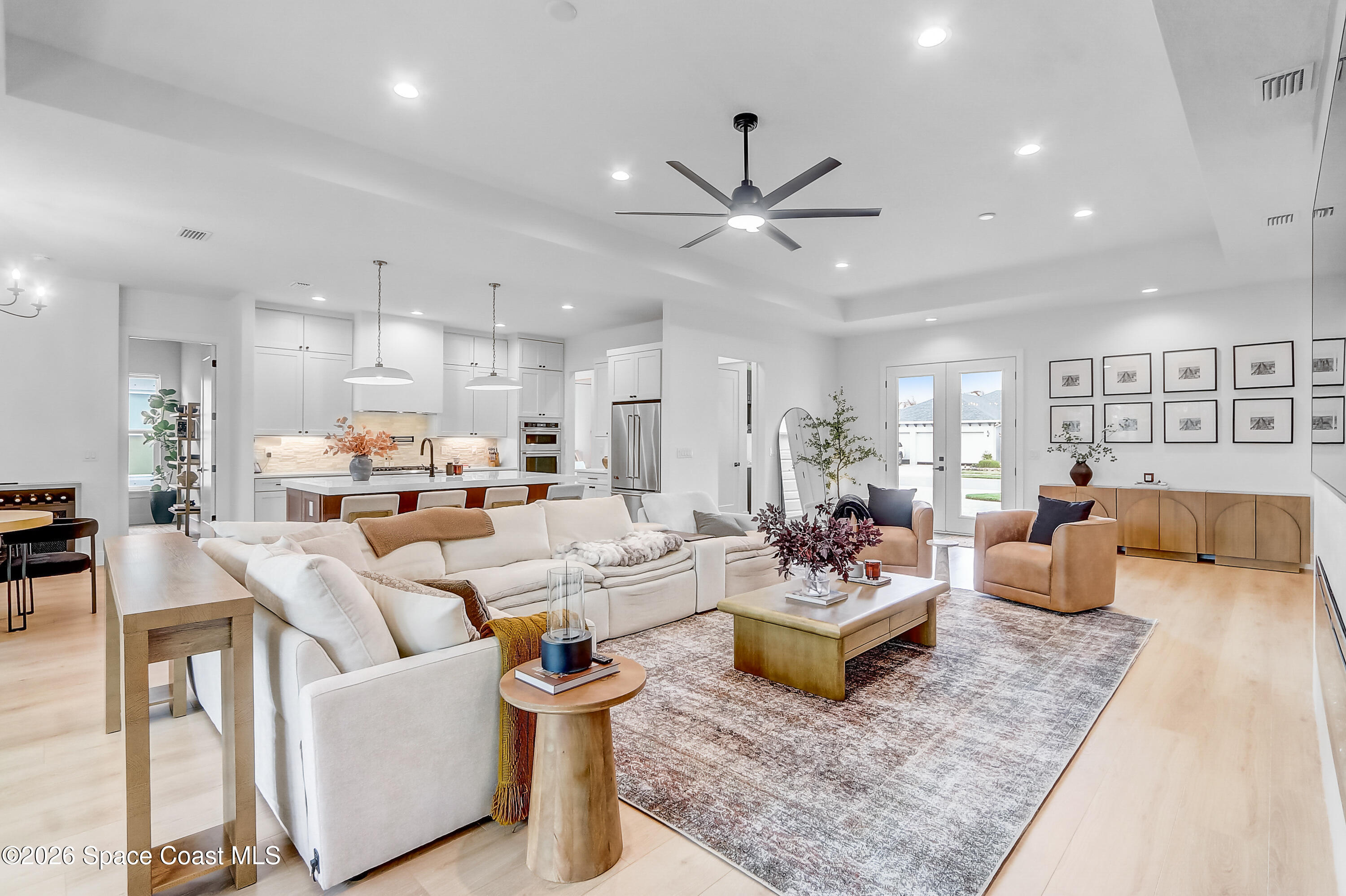 4225 Negal Circle Melbourne, FL 32901 - Photo 13 of 62 a living room with furniture kitchen view and a table