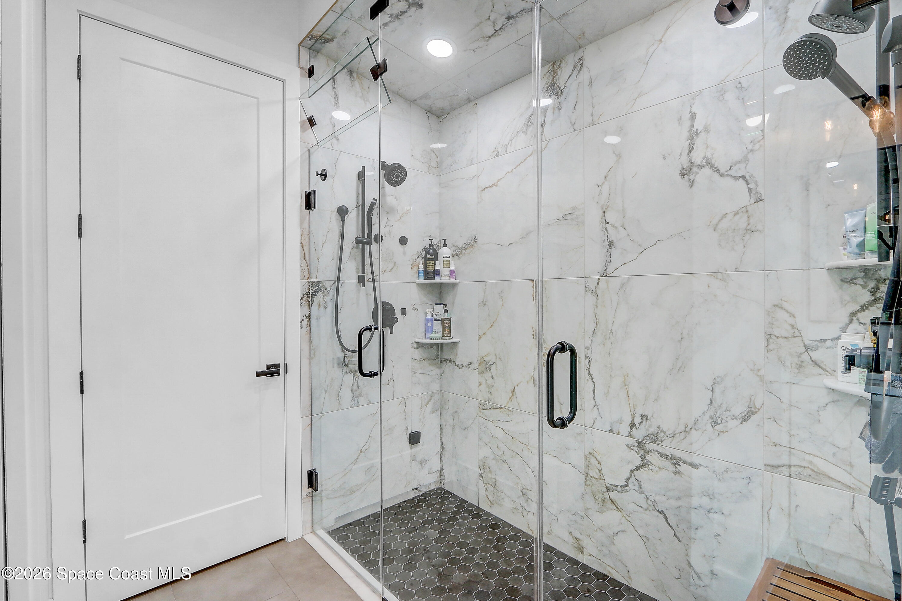 4225 Negal Circle Melbourne, FL 32901 - Photo 26 of 62 a bathroom with a shower