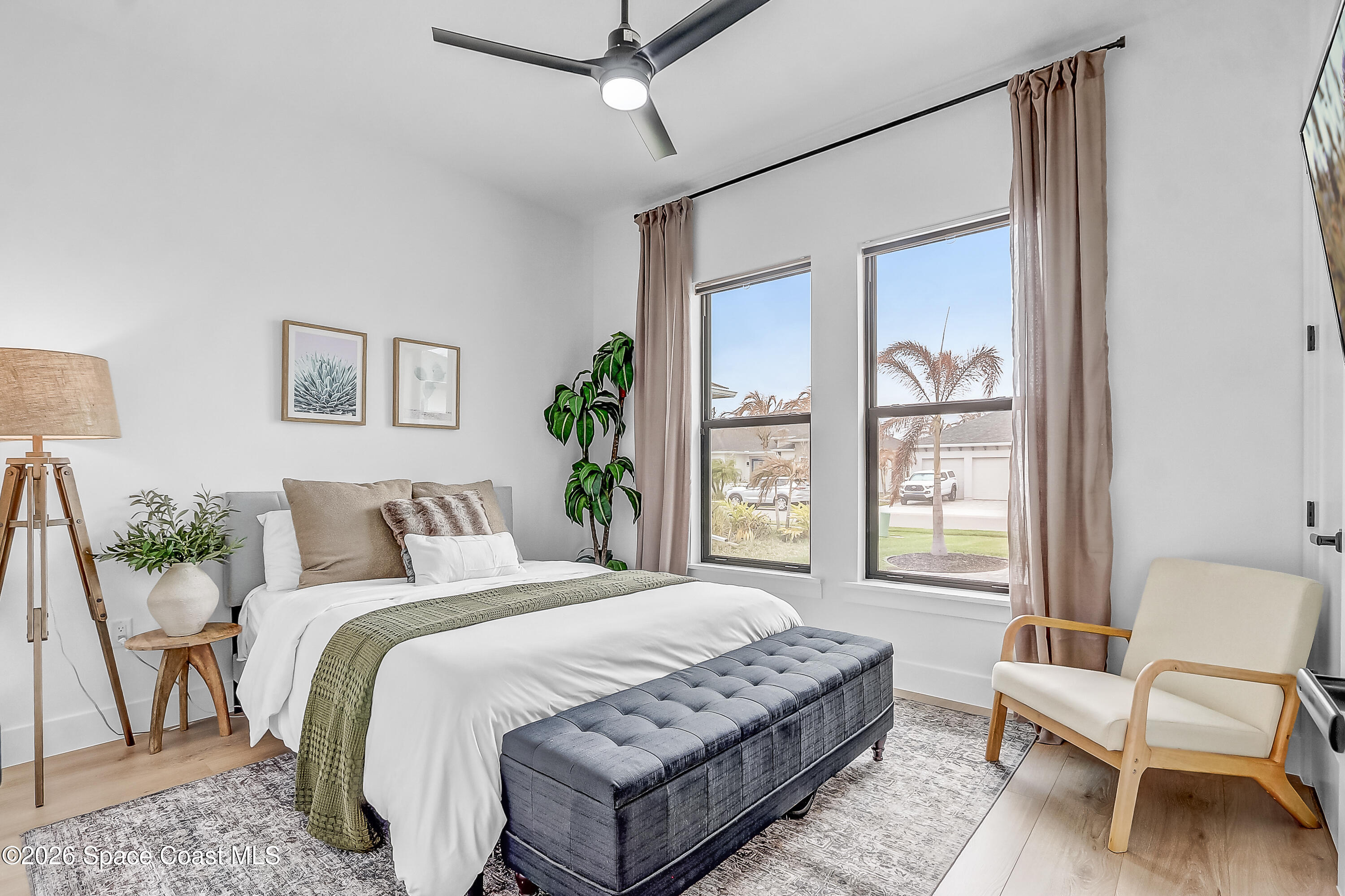 4225 Negal Circle Melbourne, FL 32901 - Photo 33 of 62 a bedroom with a large bed and a window