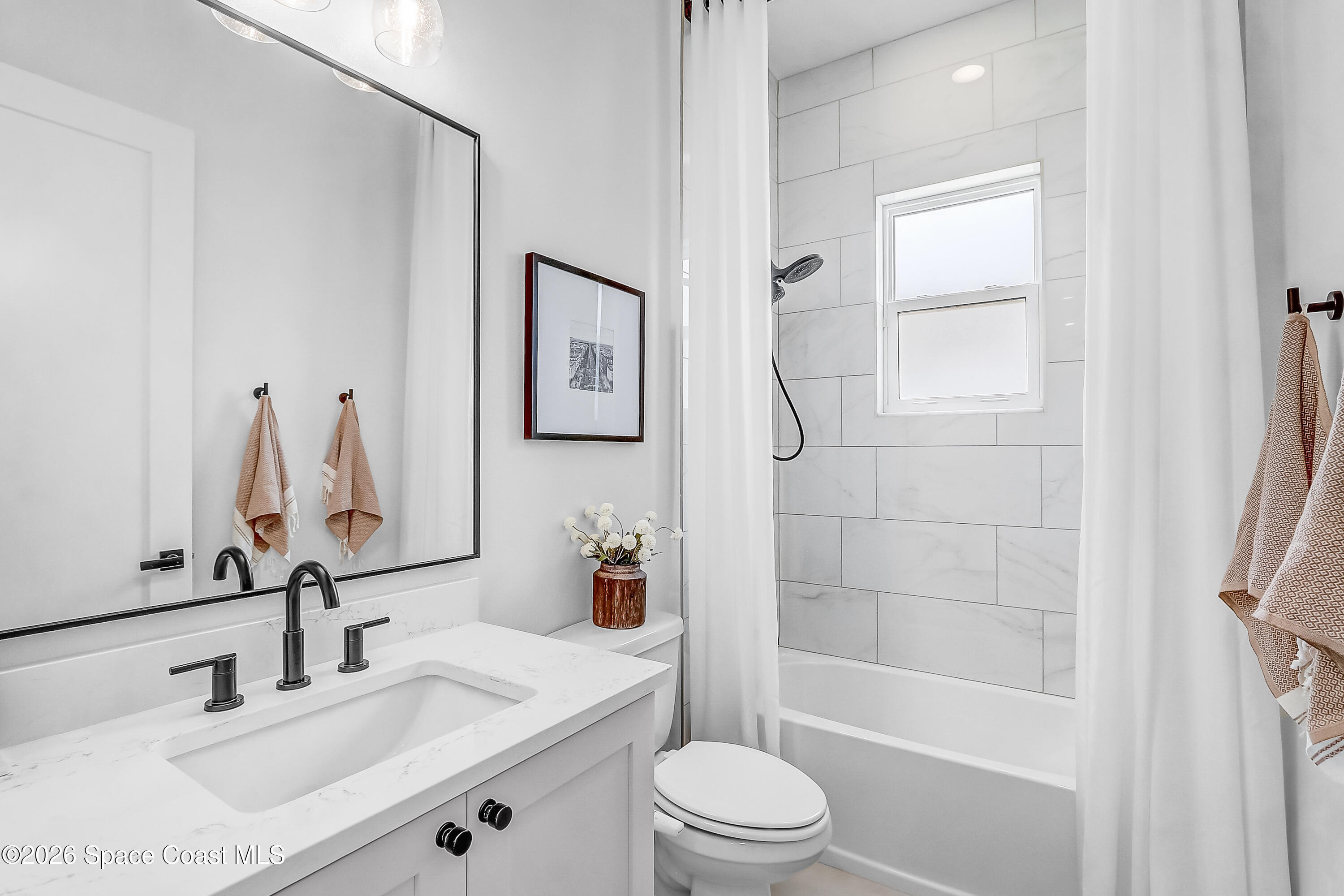 4225 Negal Circle Melbourne, FL 32901 - Photo 35 of 62 a bathroom with a sink a toilet and shower