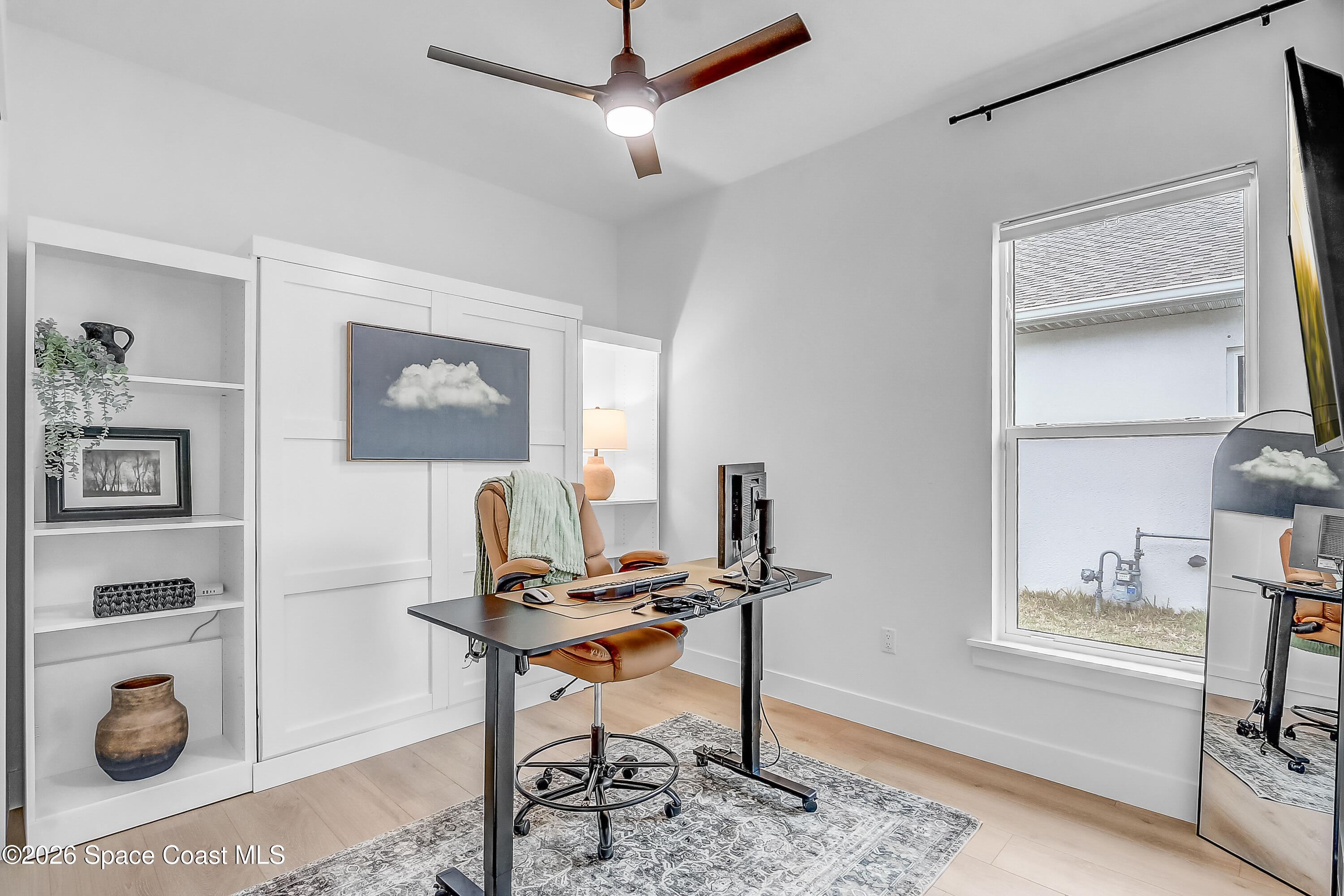 4225 Negal Circle Melbourne, FL 32901 - Photo 42 of 62 a workspace with furniture and a window