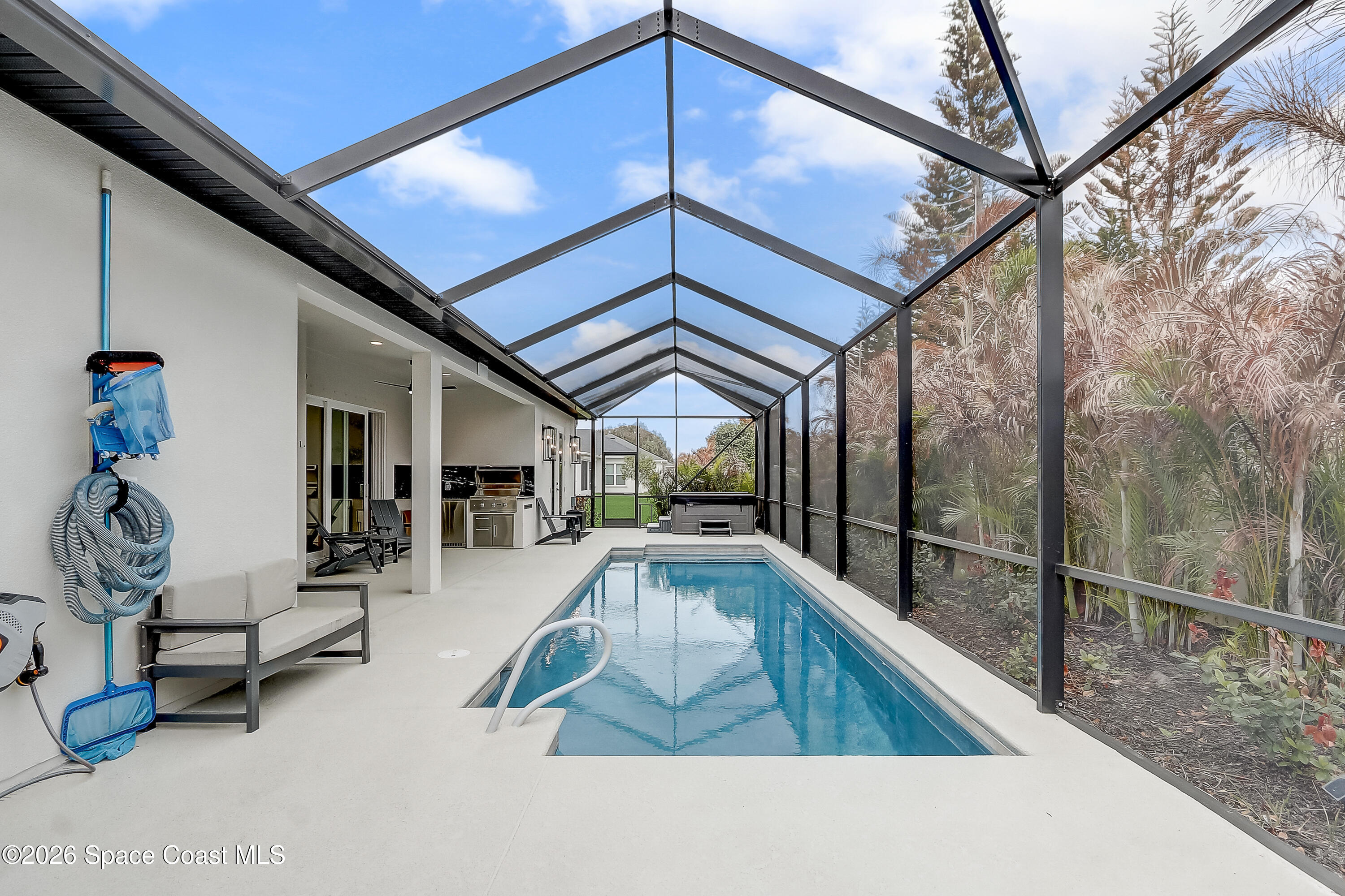4225 Negal Circle Melbourne, FL 32901 - Photo 45 of 62 a view of swimming pool with seating space