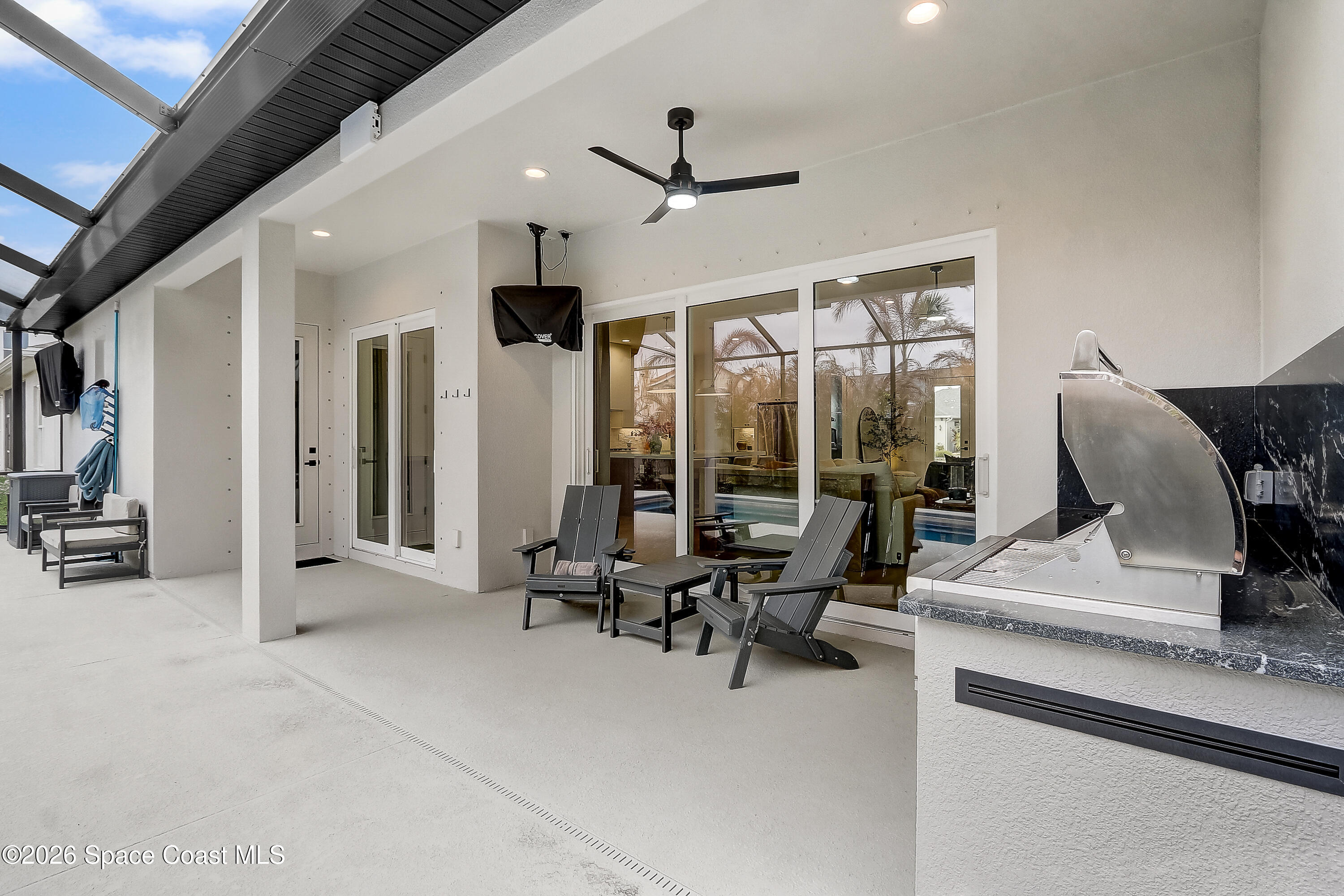 4225 Negal Circle Melbourne, FL 32901 - Photo 47 of 62 a view of a livingroom with furniture and floor to ceiling window