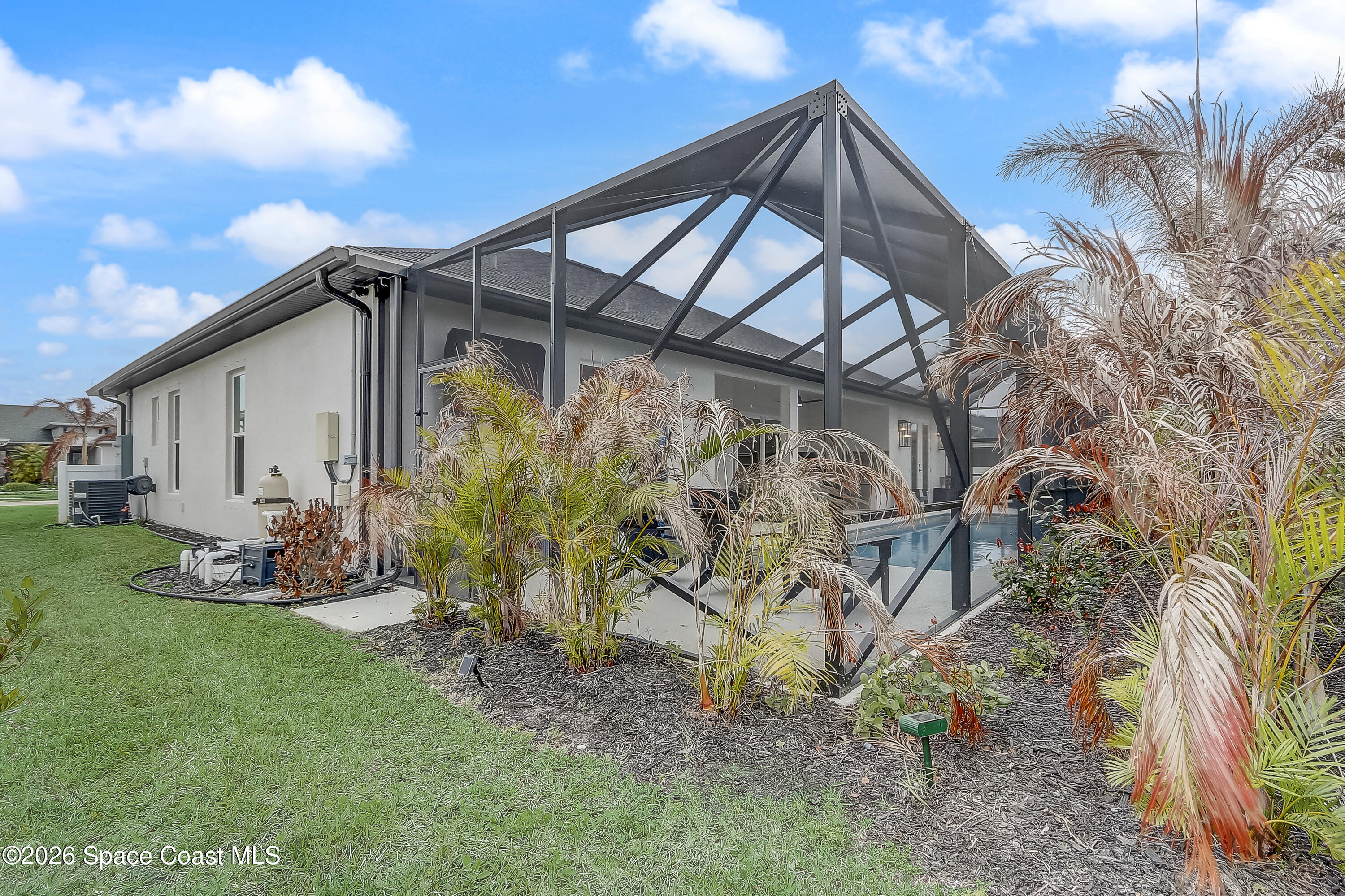 4225 Negal Circle Melbourne, FL 32901 - Photo 55 of 62 a backyard of a house with table and chairs