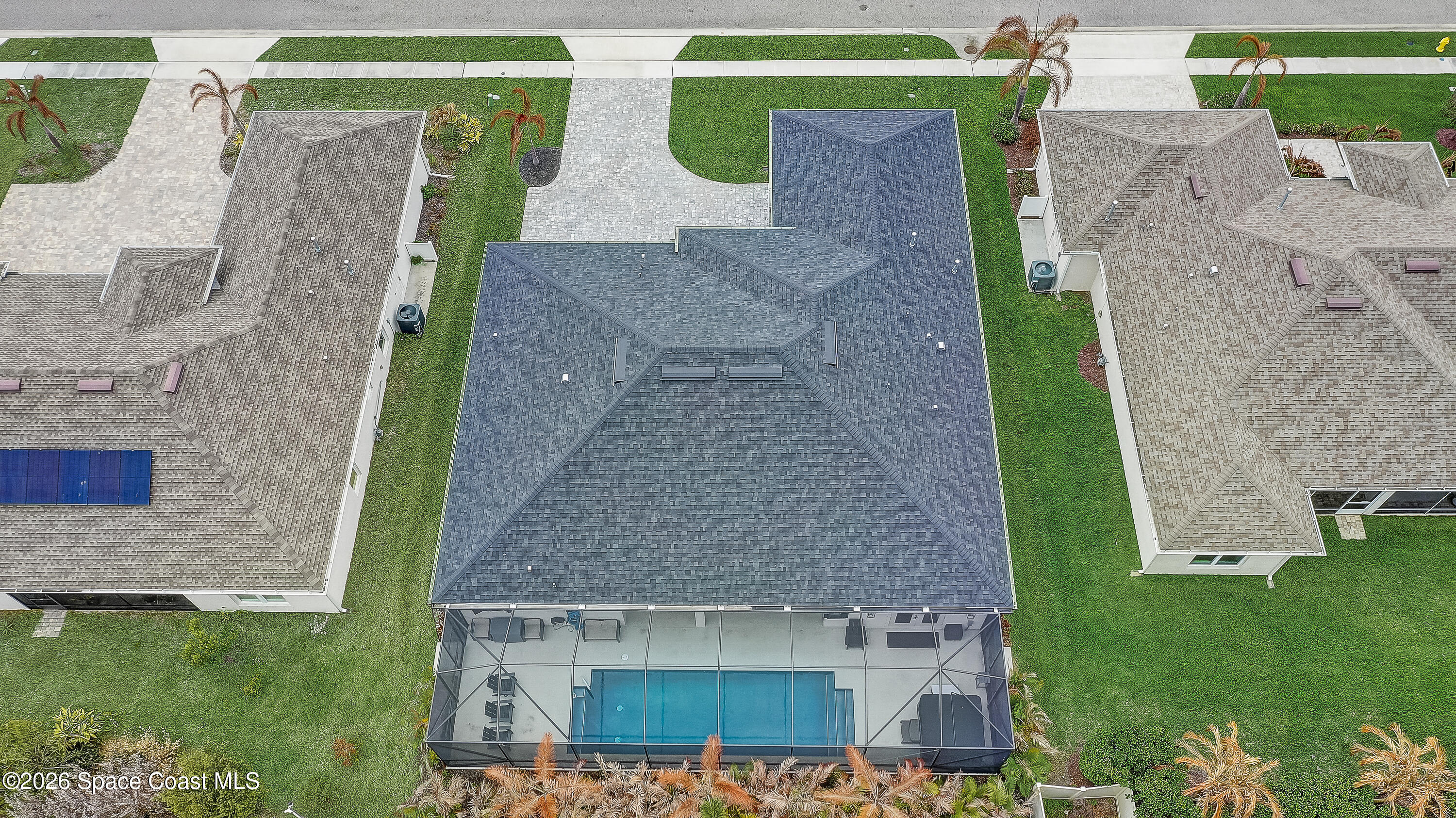 4225 Negal Circle Melbourne, FL 32901 - Photo 58 of 62 an aerial view of a house with garden space and a patio