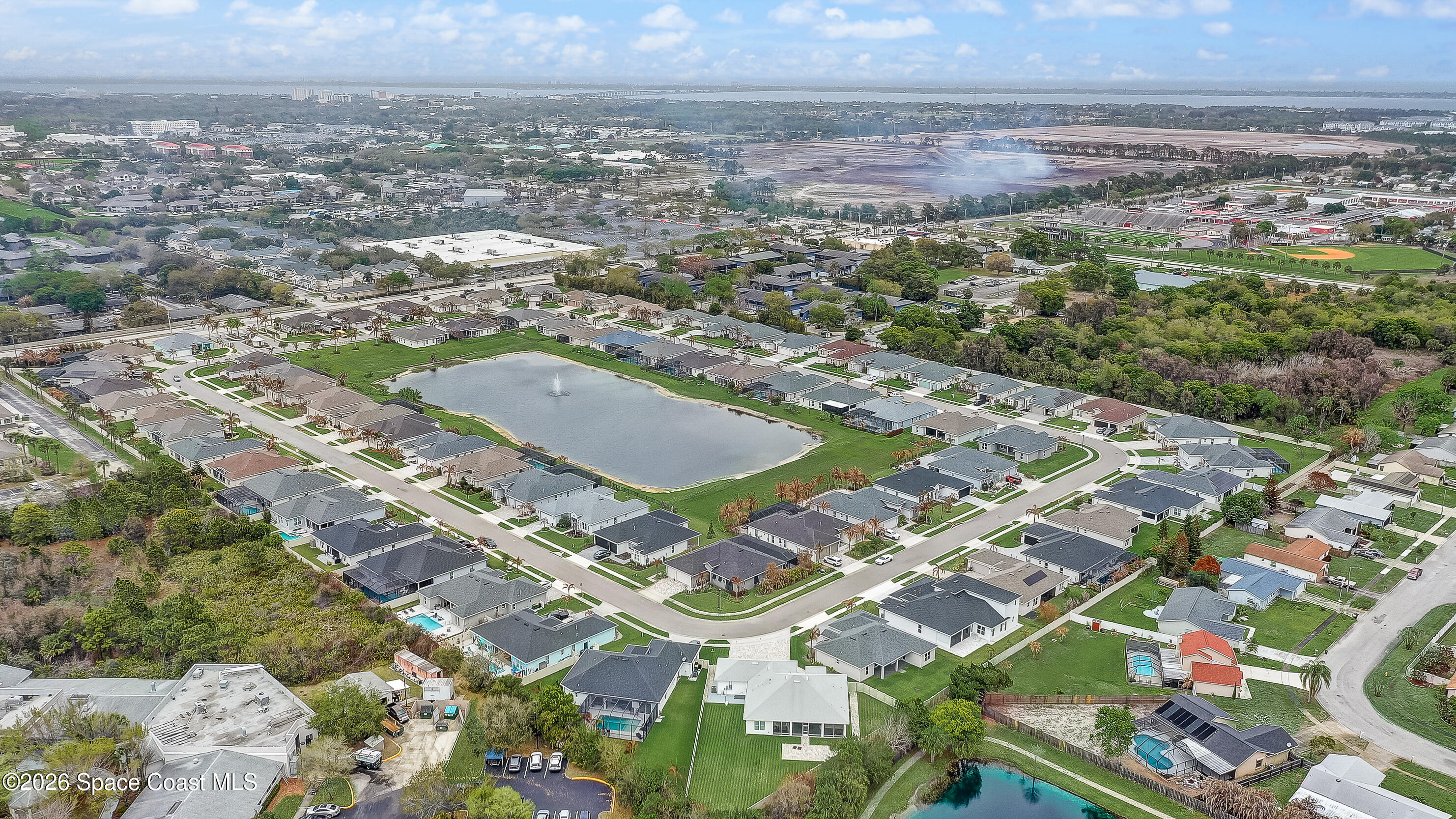 4225 Negal Circle Melbourne, FL 32901 - Photo 62 of 62 an aerial view of residential houses with outdoor space