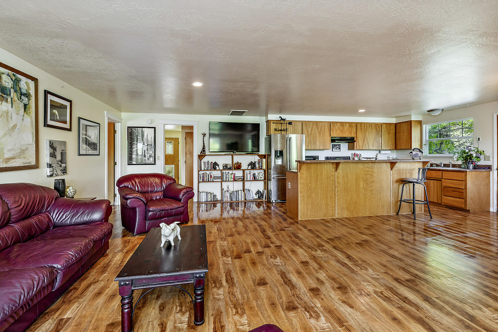 855 Holton Road Talent, OR 97540 - Photo 19 of 78 a living room with furniture a flat screen tv and kitchen view