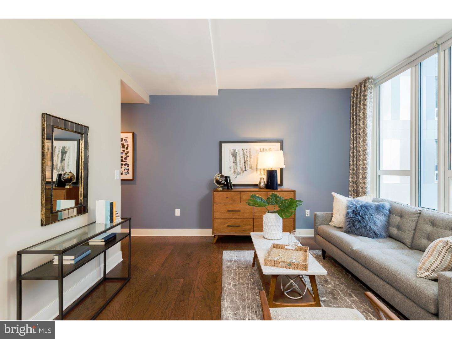 1900-20 Arch Street, Unit 1017 Philadelphia, PA 19103 - Photo 3 of 30 a living room with furniture and a window