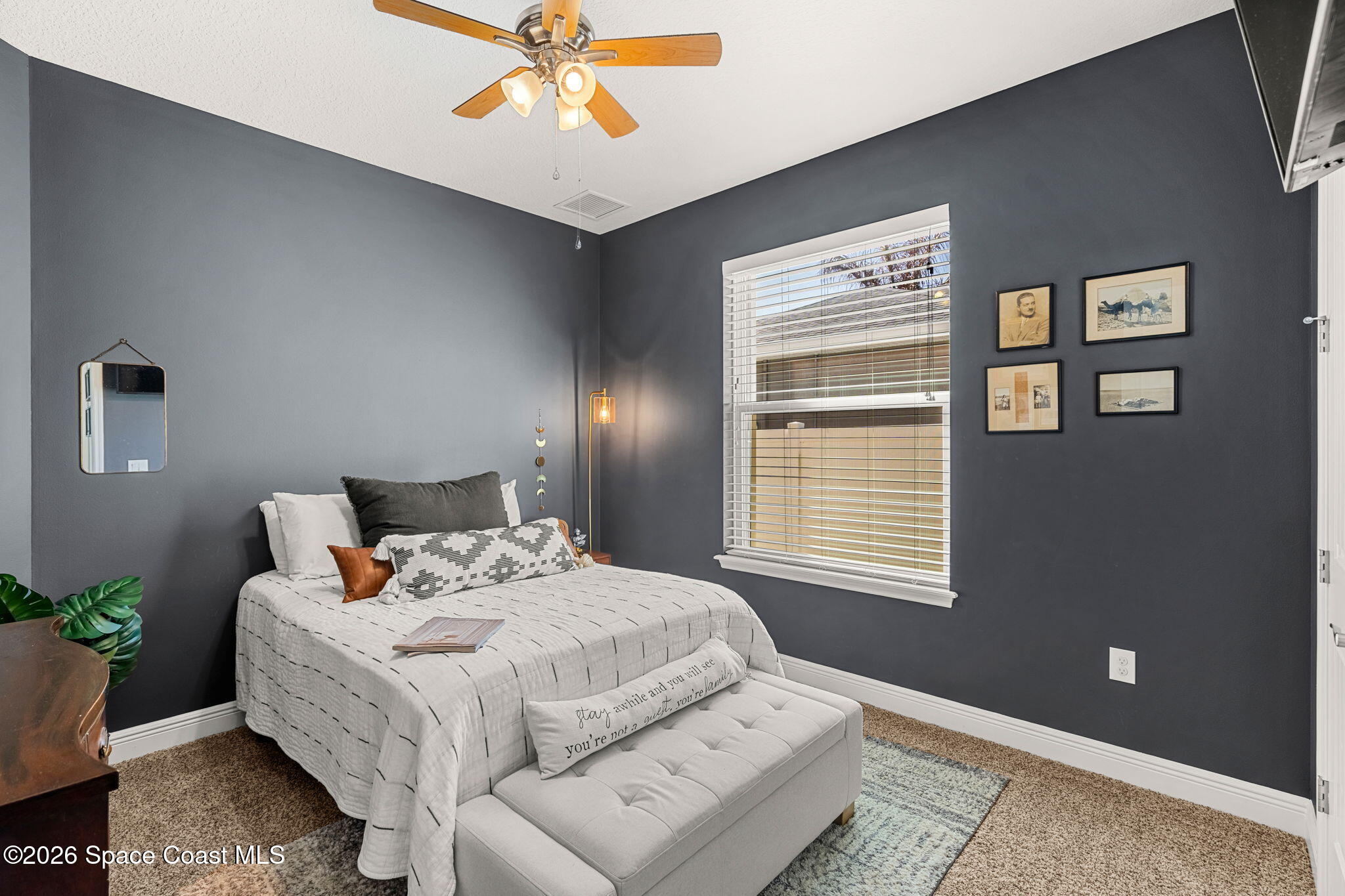 840 Hawks Ridge Court Northeast Palm Bay, FL 32905 - Photo 19 of 41 a bedroom with bed and window