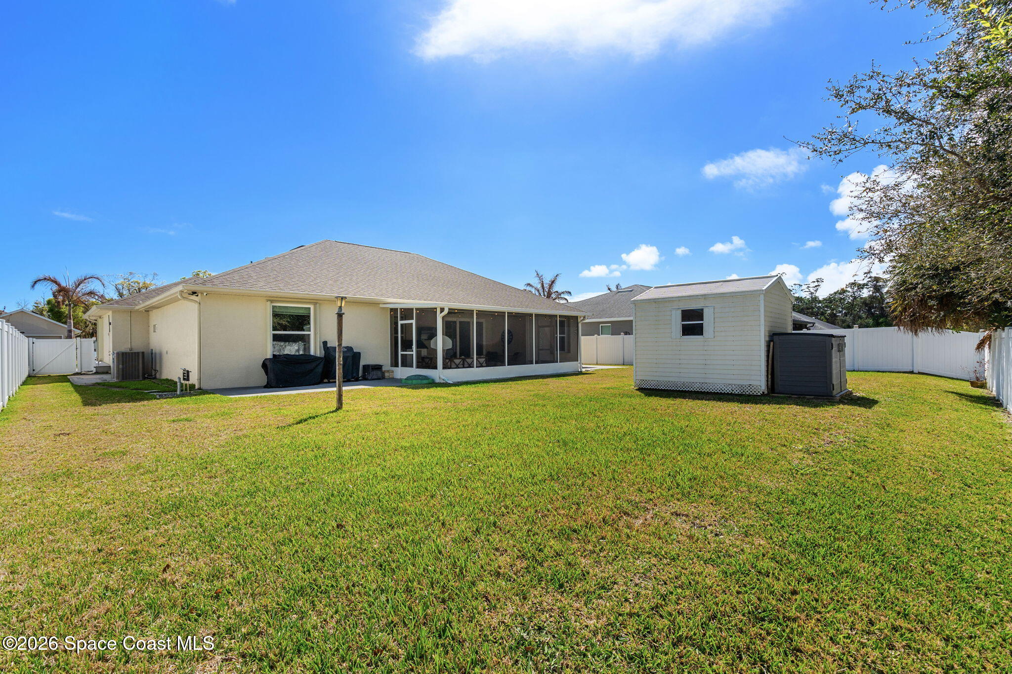 840 Hawks Ridge Court Northeast Palm Bay, FL 32905 - Photo 28 of 41 a house with swimming pool in front of it