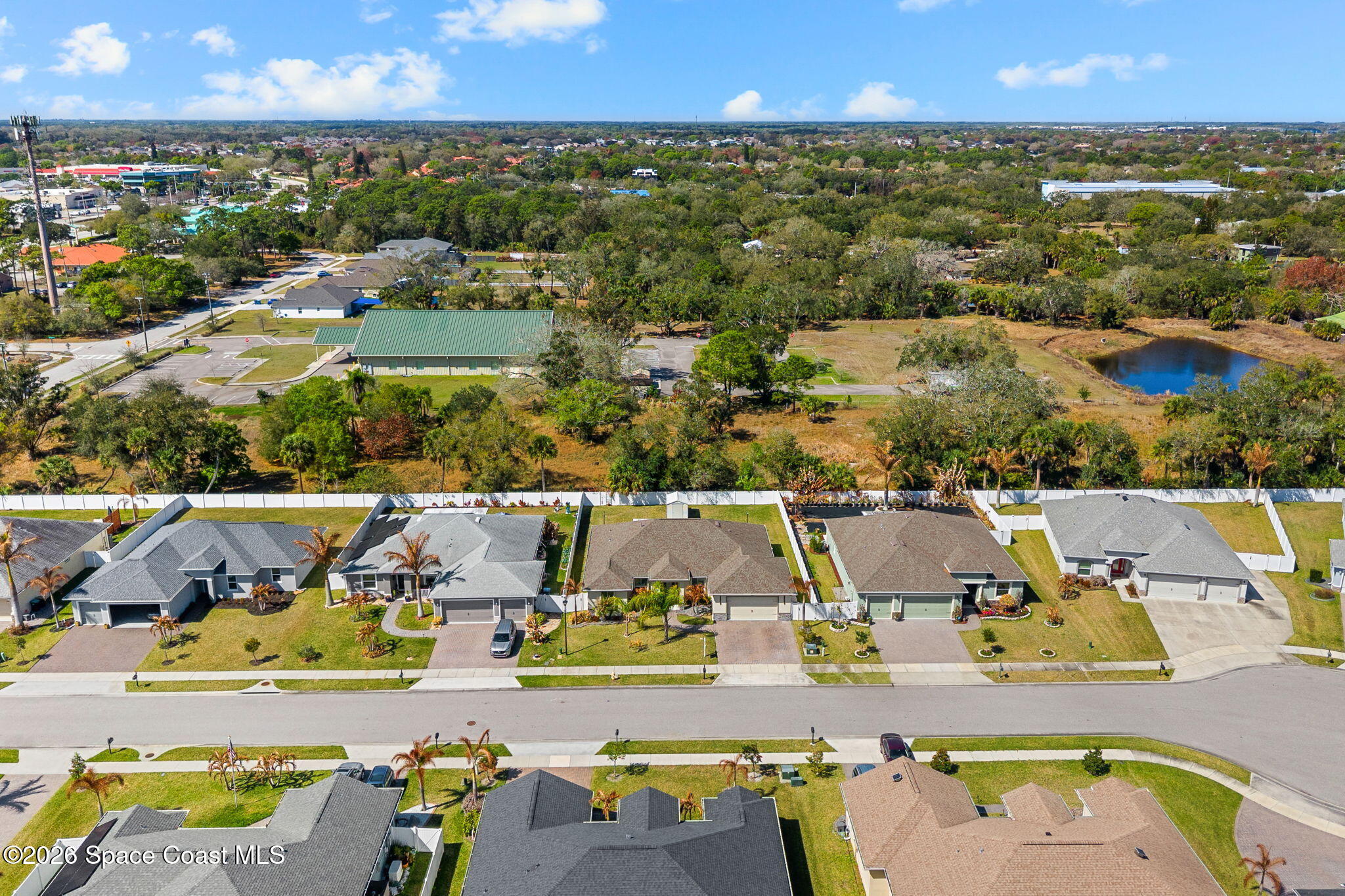 840 Hawks Ridge Court Northeast Palm Bay, FL 32905 - Photo 38 of 41 an aerial view of residential houses with outdoor space and swimming pool