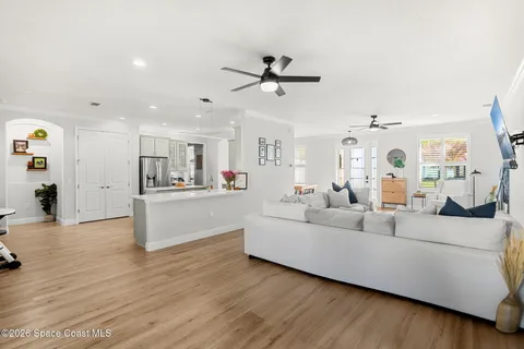 a kitchen with a sink a refrigerator and cabinets