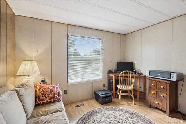 a bedroom with furniture and a window