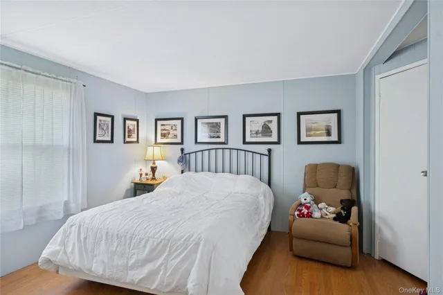 a bedroom with a bed and couch