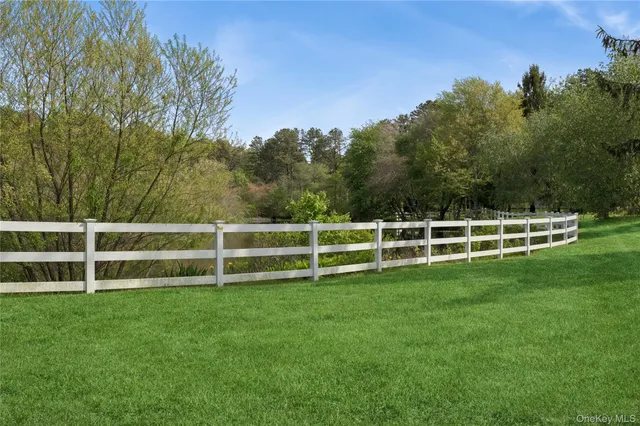 a view of a white fence